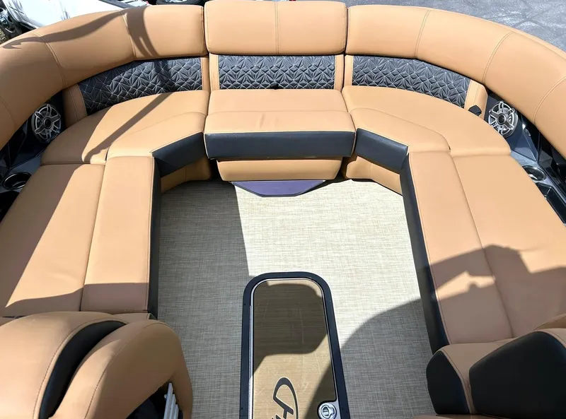 Slide: The Image of Luxurious seating on 2023 Harris Grand Mariner 230 pontoon boat, featuring tan upholstery. - 4