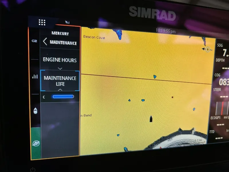 Slide: The Image of Simrad navigation display on 2023 Harris Grand Mariner 230 boat, showing maintenance and map details. - 42