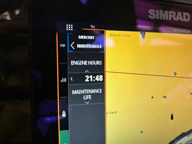 Slide: The Image of Display screen showing engine hours and maintenance for 2023 Harris Grand Mariner 230. - 43
