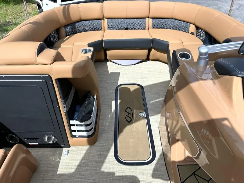 Slide: The Image of Luxurious interior of 2023 Harris Grand Mariner 230 pontoon boat with plush seating and cup holders. - 45