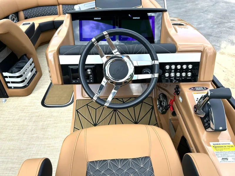 Slide: The Image of 2023 Harris Grand Mariner 230 helm with modern controls and dual Simrad displays. - 5