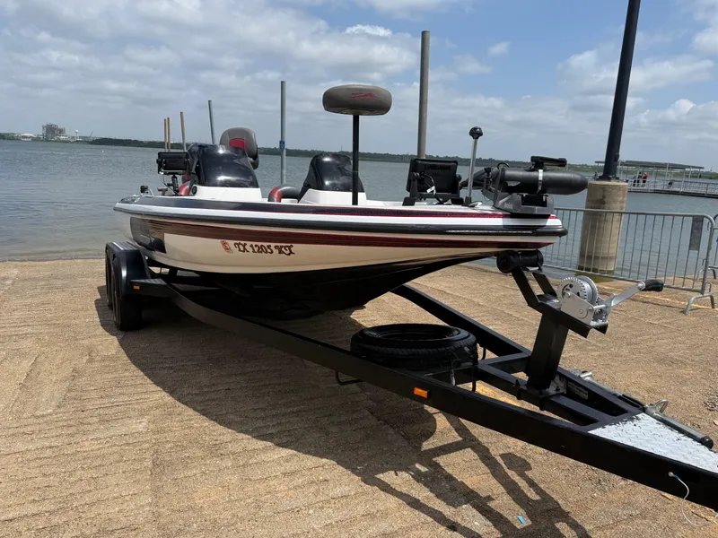Slide: The Image of 2003 Skeeter SX190 boat on trailer by lakeside. - 24