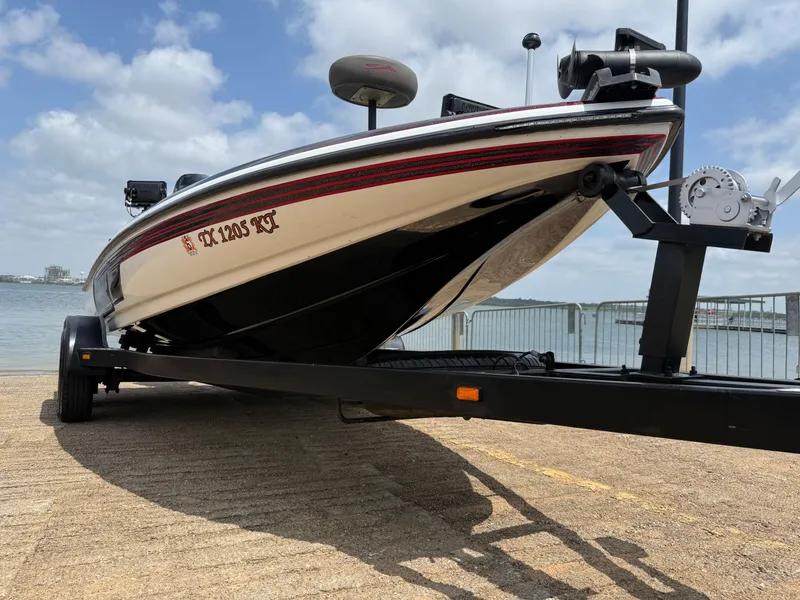 Slide: The Image of 2003 Skeeter SX190 boat on trailer by lakeside. - 25