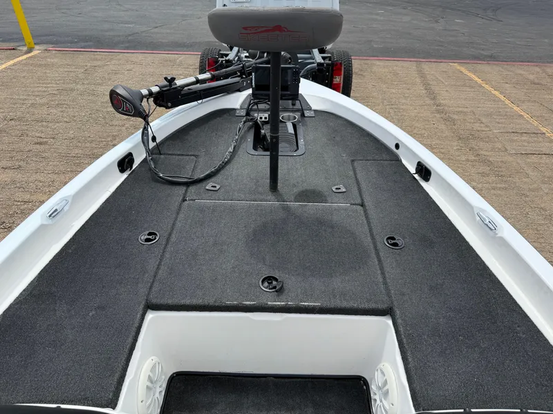 Slide: The Image of 2003 Skeeter SX190 boat with gray deck and controls. - 28