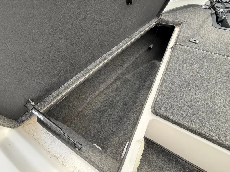 Slide: The Image of Open storage compartment in 2003 Skeeter SX190 boat. - 30