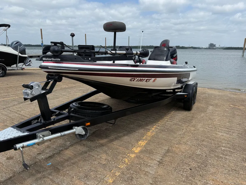 Slide: The Image of Open storage compartment of a 2003 Skeeter SX190 boat. - 32