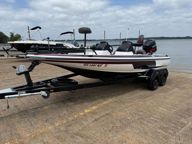 Slide: The Image of Interior view of a 2003 Skeeter SX190 boat with speakers. - 33