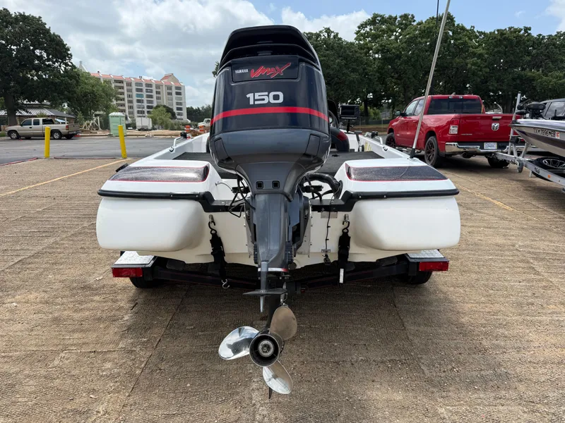 Slide: The Image of Interior view of a 2003 Skeeter SX190 boat with battery and cables. - 47