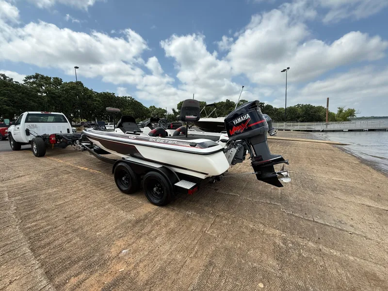 Slide: The Image of 2003 Skeeter SX190 boat with Yamaha engine on trailer at boat ramp. - 7