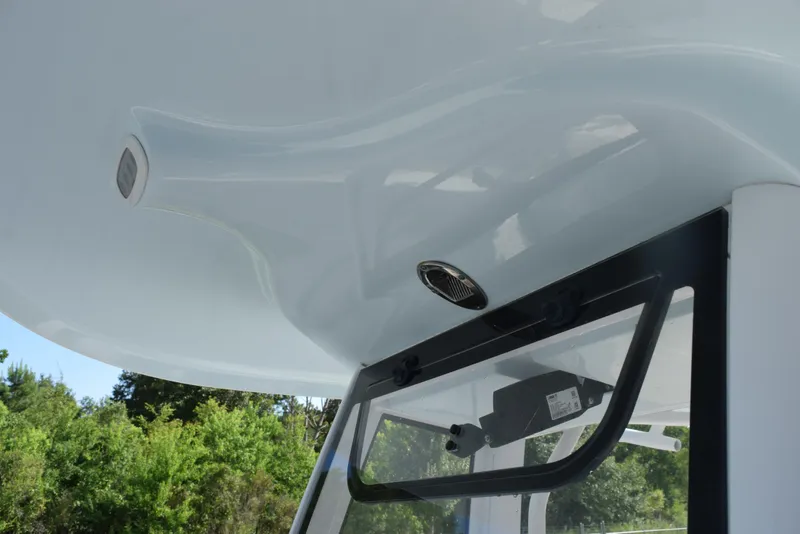 Slide: The Image of 2019 Sea Hunt Ultra 235 SE boat canopy and windshield detail. - 14