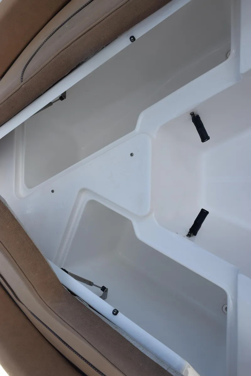 Slide: The Image of 2019 Sea Hunt Ultra 235 SE boat storage compartment, open and empty. - 15