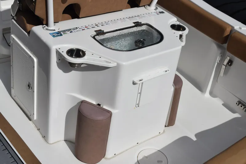 Slide: The Image of 2019 Sea Hunt Ultra 235 SE boat interior with livewell and cup holders. - 8