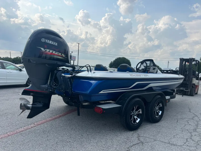 Slide: The Image of 2018 Skeeter ZX190 boat with Yamaha VMAX engine on a trailer in a parking lot. - 11