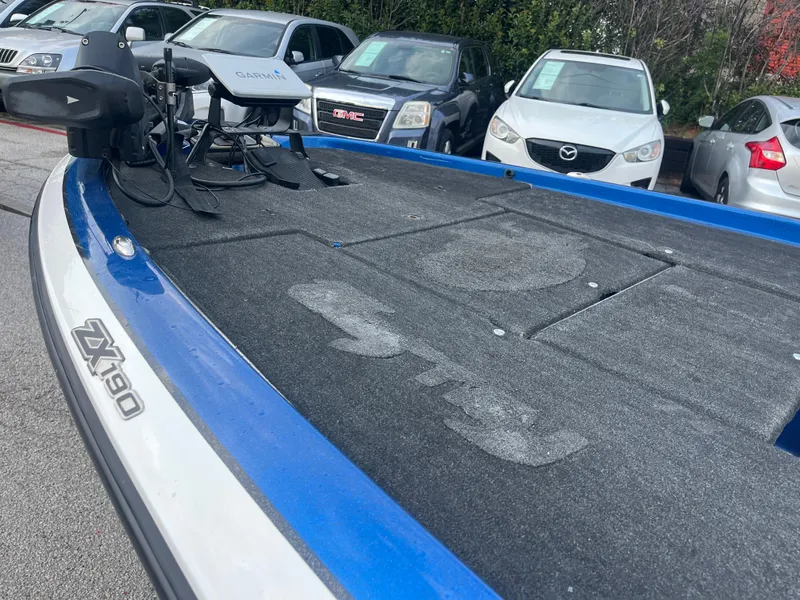 Slide: The Image of 2018 Skeeter ZX190 boat deck with Garmin equipment, parked near cars. - 20