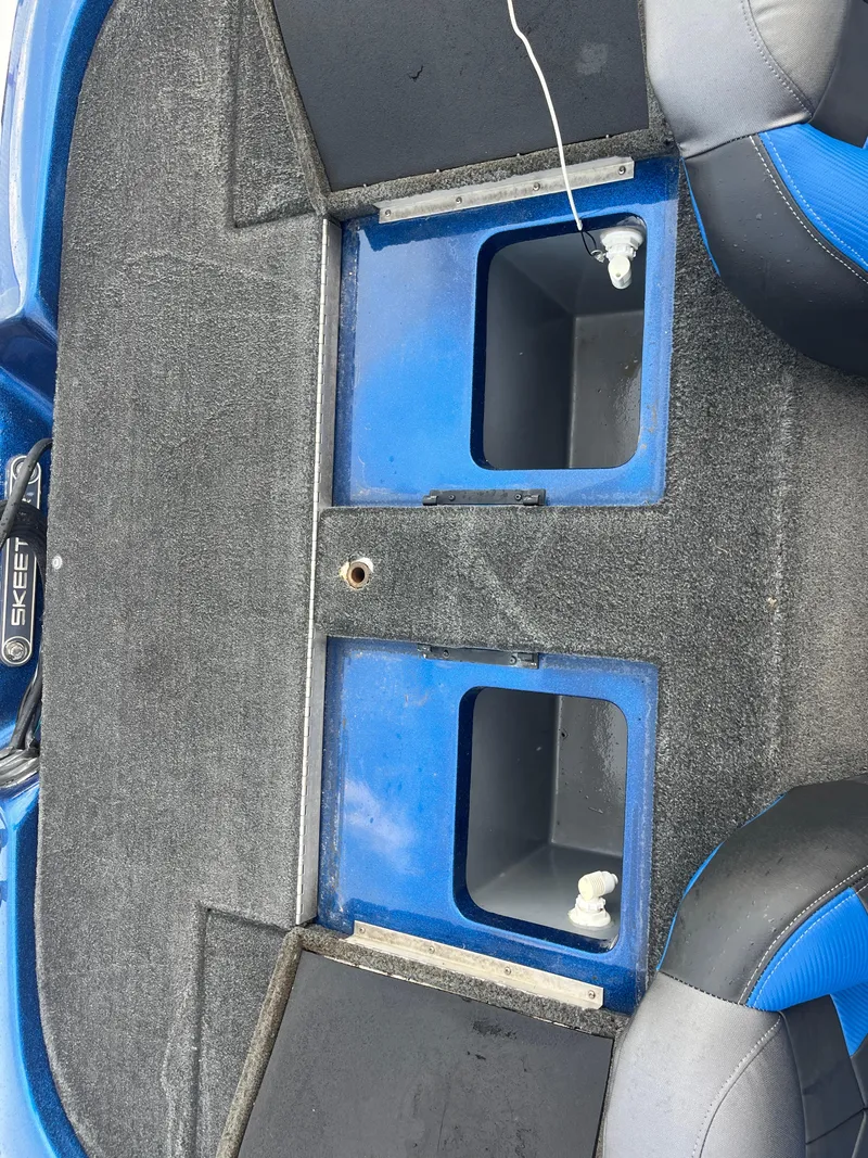 Slide: The Image of 2018 Skeeter ZX190 boat interior with storage compartments and seating. - 31