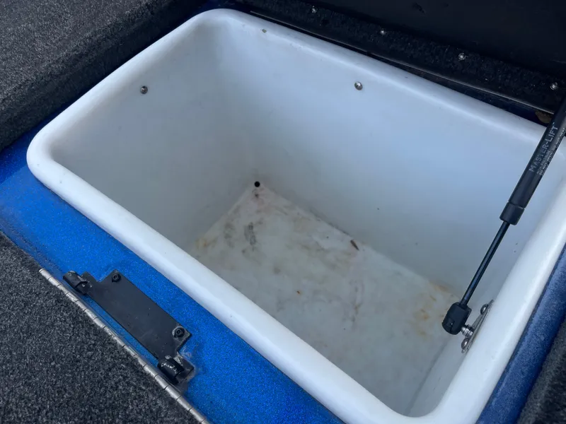 Slide: The Image of 2018 Skeeter ZX190 boat storage compartment, open and empty, with hydraulic lift support. - 32