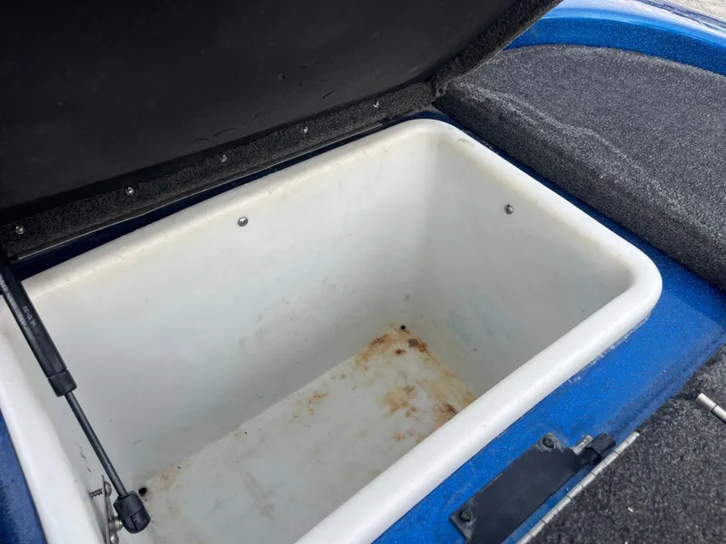 Slide: The Image of Open storage compartment in 2018 Skeeter ZX190 boat, showing interior details. - 33
