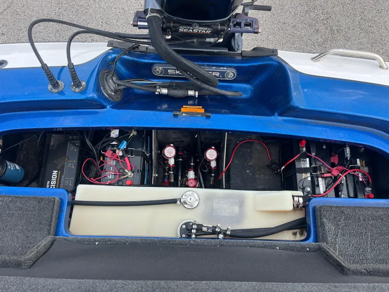 Slide: The Image of 2018 Skeeter ZX190 boat battery compartment with wiring and components. - 34