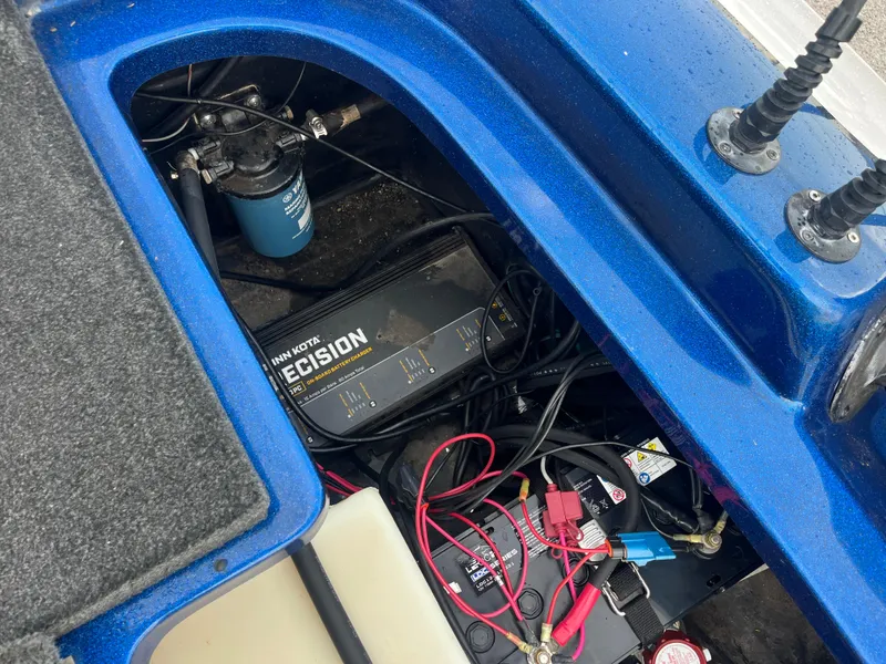 Slide: The Image of 2018 Skeeter ZX190 boat battery compartment with Minn Kota Precision charger and wiring. - 35