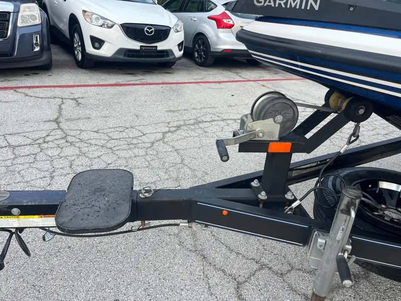 Slide: The Image of Trailer hitch of 2018 Skeeter ZX190 boat in parking lot with cars. - 38