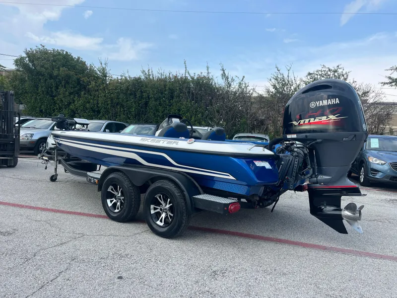 Slide: The Image of 2018 Skeeter ZX190 boat with Yamaha VMAX engine, parked outdoors. - 5