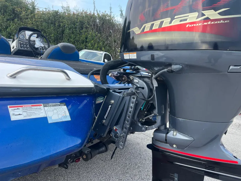 Slide: The Image of 2018 Skeeter ZX190 boat with VMAX four-stroke engine, blue exterior, and detailed dashboard view. - 7