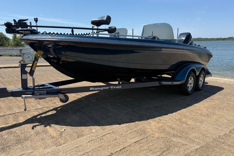 Slide: The Image of 1999 Ranger 620VS Fisherman boat on trailer by the lake. - 2