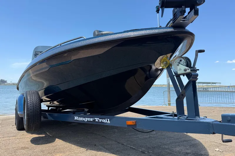 Slide: The Image of 1999 Ranger 620VS Fisherman boat on trailer by the water. - 26