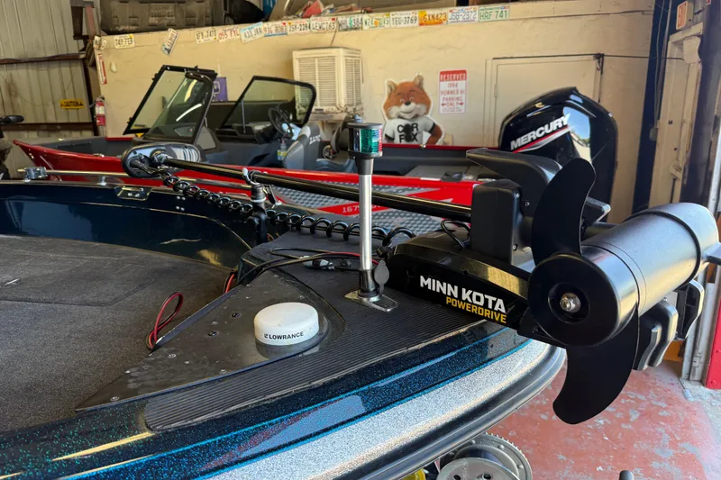 Slide: The Image of 1999 Ranger 620VS Fisherman boat with Minn Kota PowerDrive motor in a garage setting. - 52