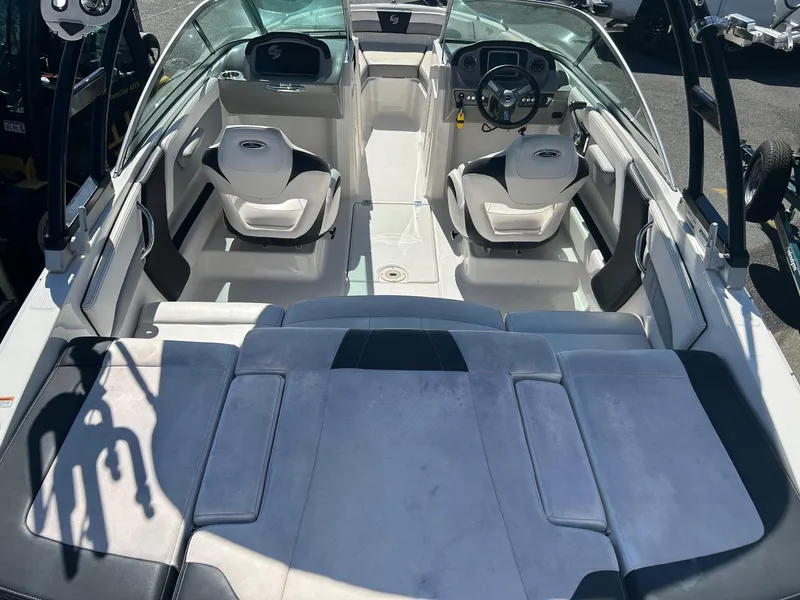 Slide: The Image of 2018 Chaparral 21 H2O Surf boat interior with seating and steering wheel. - 14