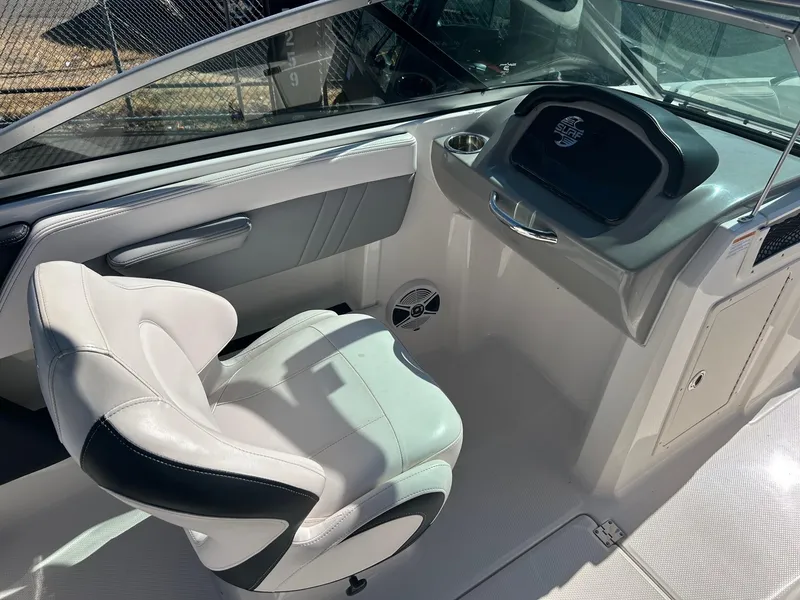 Slide: The Image of Interior of 2018 Chaparral 21 H2O Surf boat with white seating and dashboard. - 5