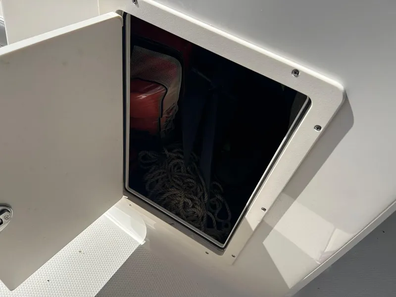 Slide: The Image of Open storage compartment on 2018 Chaparral 21 H2O Surf boat. - 7