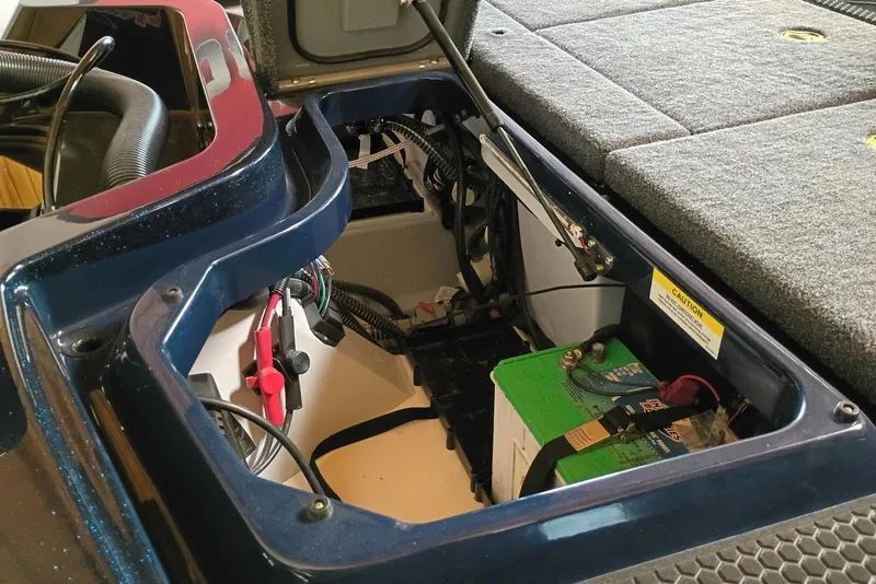 Slide: The Image of iKon VLX20 2026 boat battery compartment with wiring and components. - 8