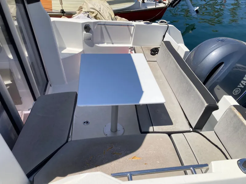 Slide: The Image of Jeanneau NC 695 boat interior with seating and table, 2018 model. - 11