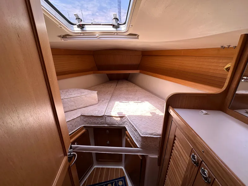 Slide: The Image of Cozy cabin interior of 2005 Catalina 36 MkII sailboat with wooden finishes and skylight. - 12