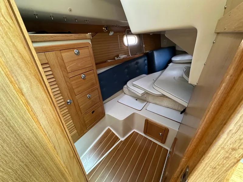 Slide: The Image of Interior of 2005 Catalina 36 MkII sailboat with wooden cabinetry and cushioned seating. - 19