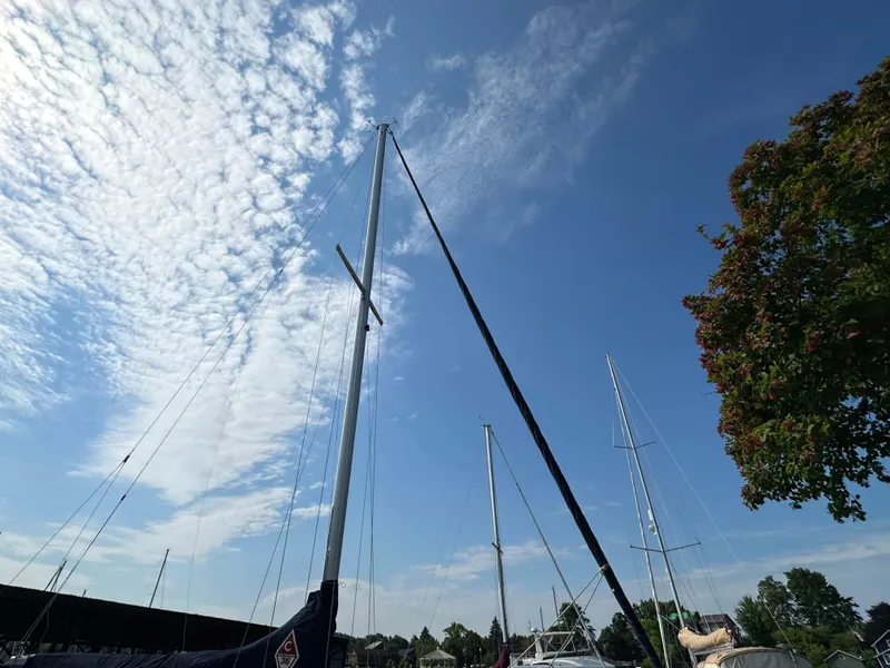 Slide: The Image of Mast of a 2005 Catalina 36 MkII sailboat against a blue sky with clouds. - 3