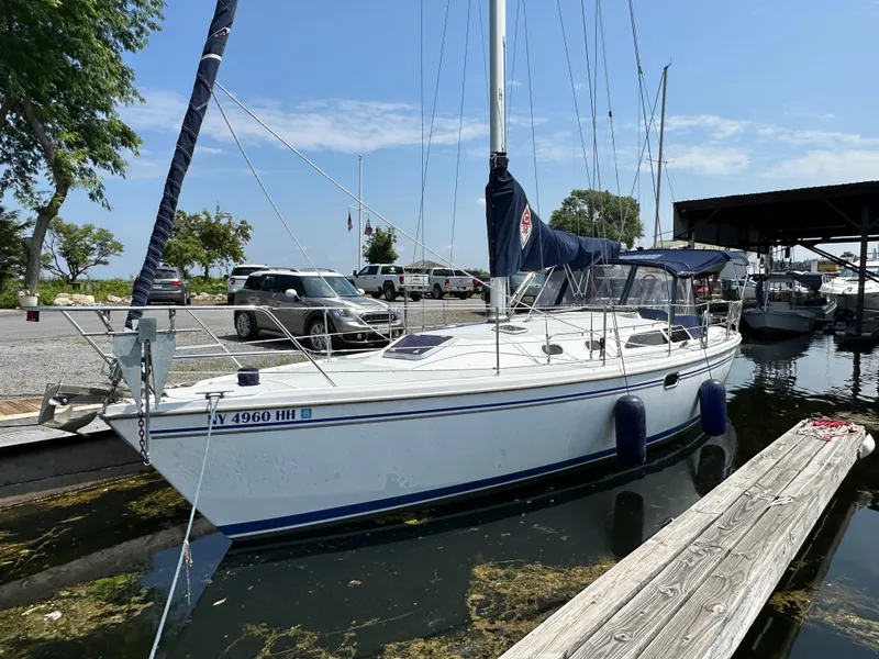 Slide: The Image of 2005 Catalina 36 MkII sailboat docked at marina under clear blue sky. - 5