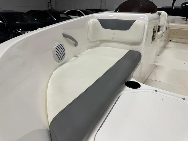 Slide: The Image of 2021 Bayliner Element E18 boat interior with white and gray seating. - 13