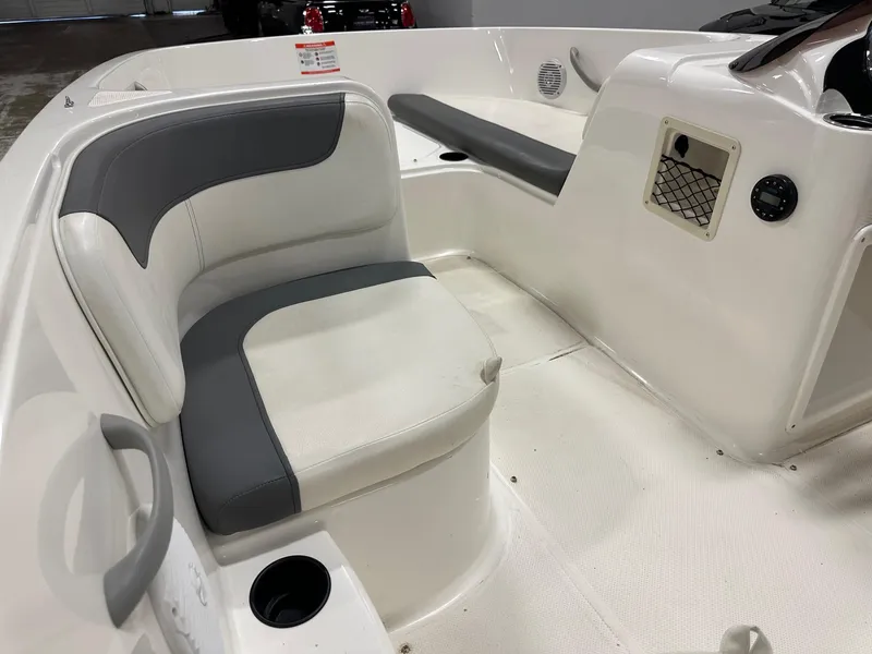 Slide: The Image of 2021 Bayliner Element E18 boat interior with gray and white seating. - 17
