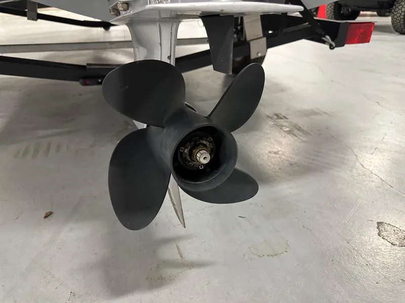 Slide: The Image of Propeller of a 2021 Bayliner Element E18 boat on a trailer. - 21