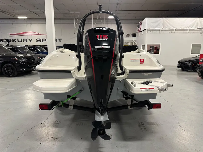 Slide: The Image of 2021 Bayliner Element E18 boat with Mercury 115 Pro XS engine in showroom. - 4