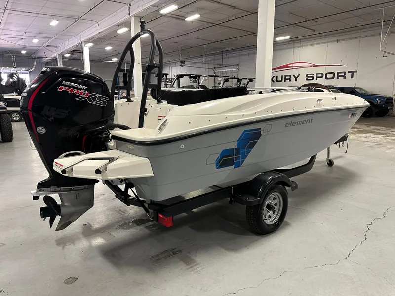 Slide: The Image of 2021 Bayliner Element E18 boat with Mercury Pro XS engine in a showroom. - 5