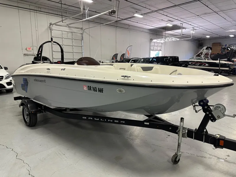 Slide: The Image of 2021 Bayliner Element E18 boat on trailer in indoor showroom. - 7