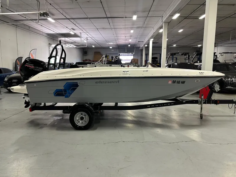 Slide: The Image of 2021 Bayliner Element E18 boat on trailer in indoor showroom. - 8
