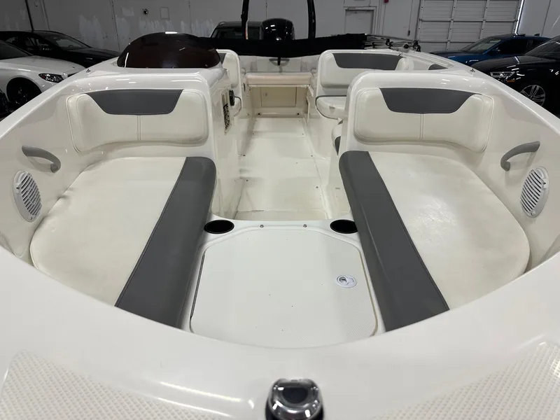Slide: The Image of 2021 Bayliner Element E18 boat interior with white and gray seating. - 9