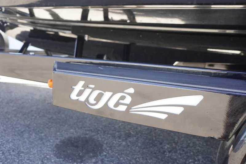 Slide: The Image of 2023 Tigé 23ZX boat trailer with logo, close-up view. - 11