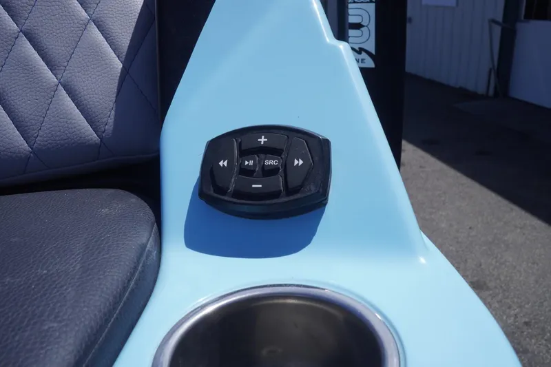 Slide: The Image of 2023 Tigé 23ZX boat control panel with cup holder and seat detail. - 12