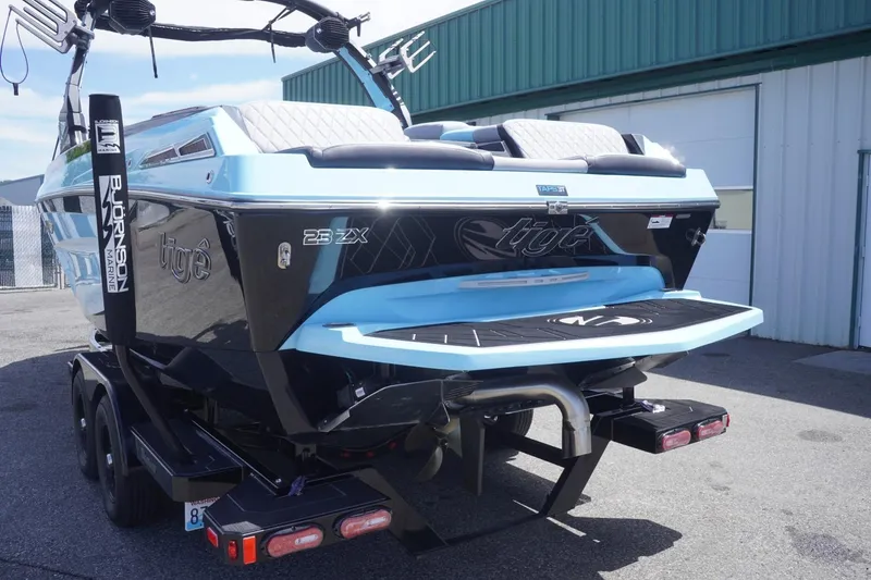 Slide: The Image of 2023 Tigé 23ZX boat on trailer, featuring sleek design and modern amenities. - 27