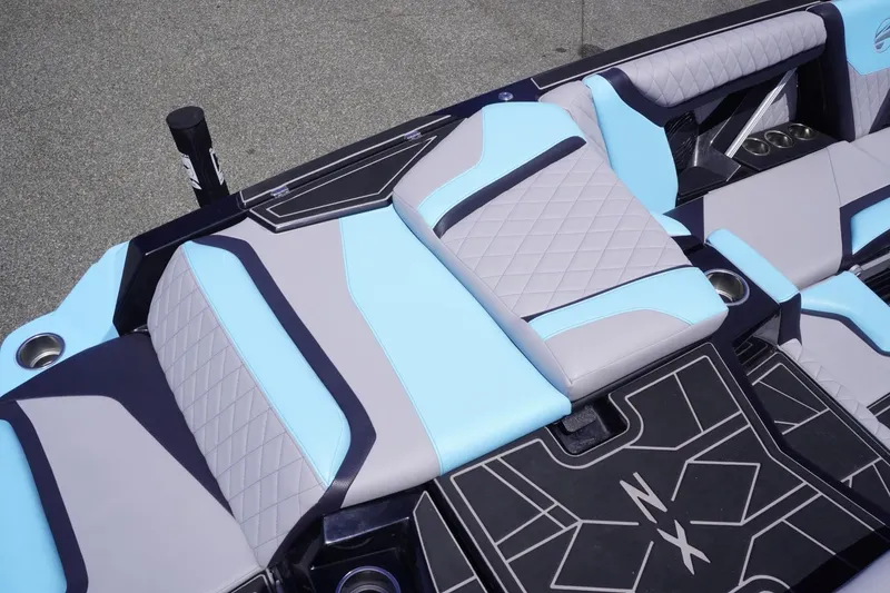 Slide: The Image of 2023 Tigé 23ZX boat interior with stylish blue and gray seating. - 32